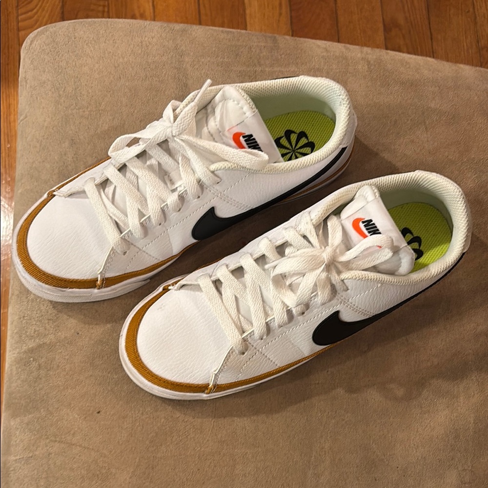 Nike women’s legacy court White and Black Sneakers with Orange/Rust Accents